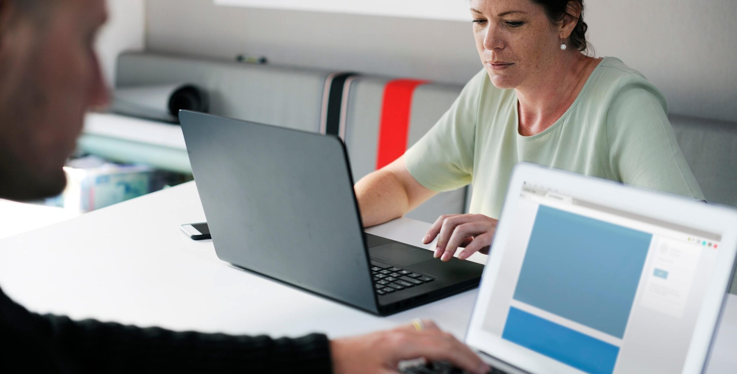 A woman researching maintenance management software