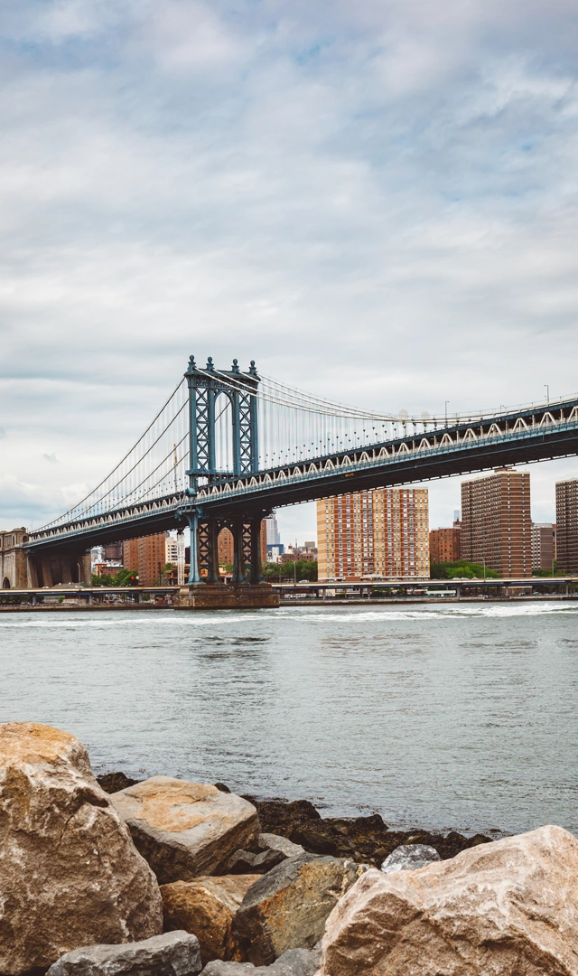 view-suspension-bridge-river-against-cloudy-sky copy